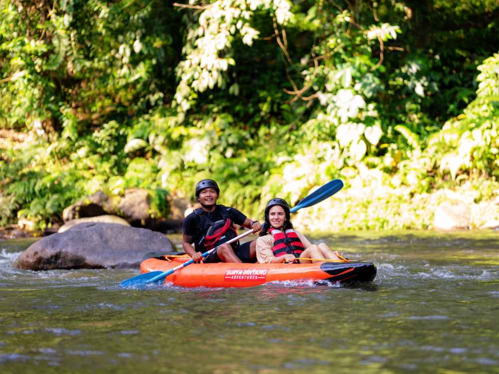 Beautiful outdoor water sports kayaking tour surrounded by Bali's natural landscape.