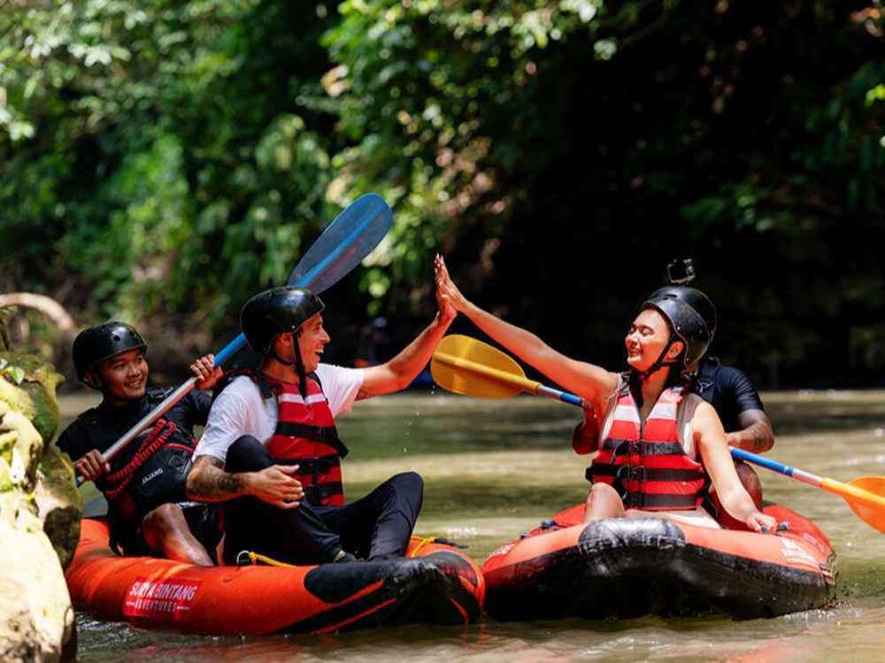 Navigating a kayak down the scenic tropical river in Bali.