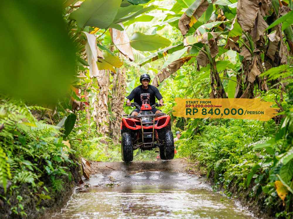 Guests enjoying a thrilling ATV ride adventure through the jungle in Ubud, Bali.